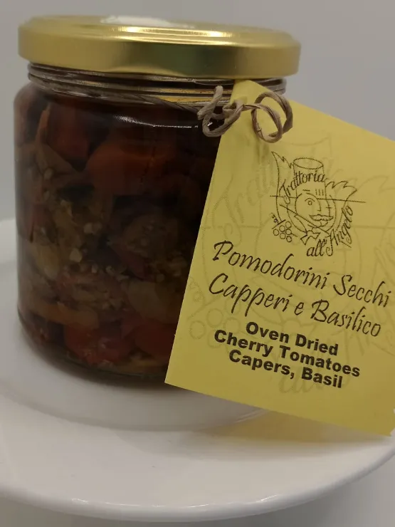 Pomodorini secchi capperi e basilico